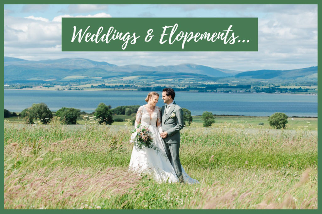 A bride and groom in a grass field with the sea and hills in the background with the text 'weddings & elopements' overlaid