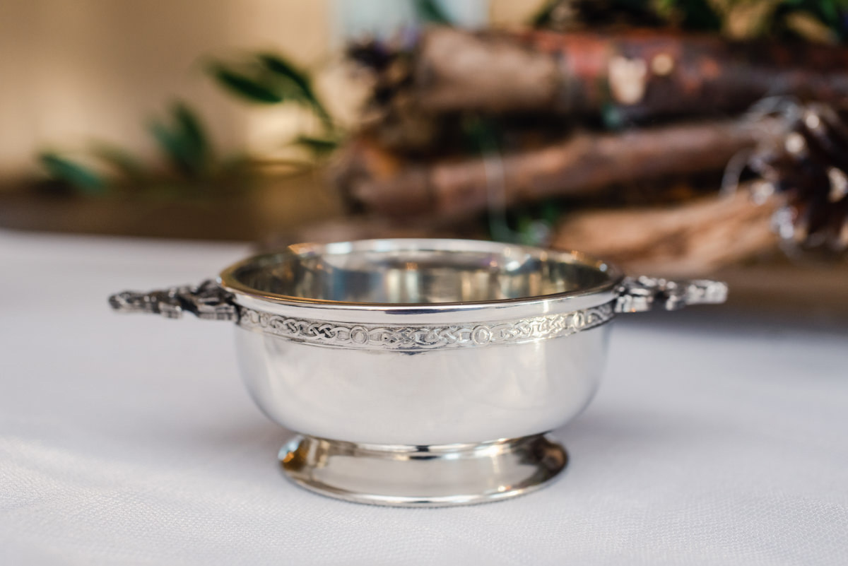 A silver Quaich on a white table cloth ready to be used at a Personalised Wedding Ceremony in Logie Country House Hotel