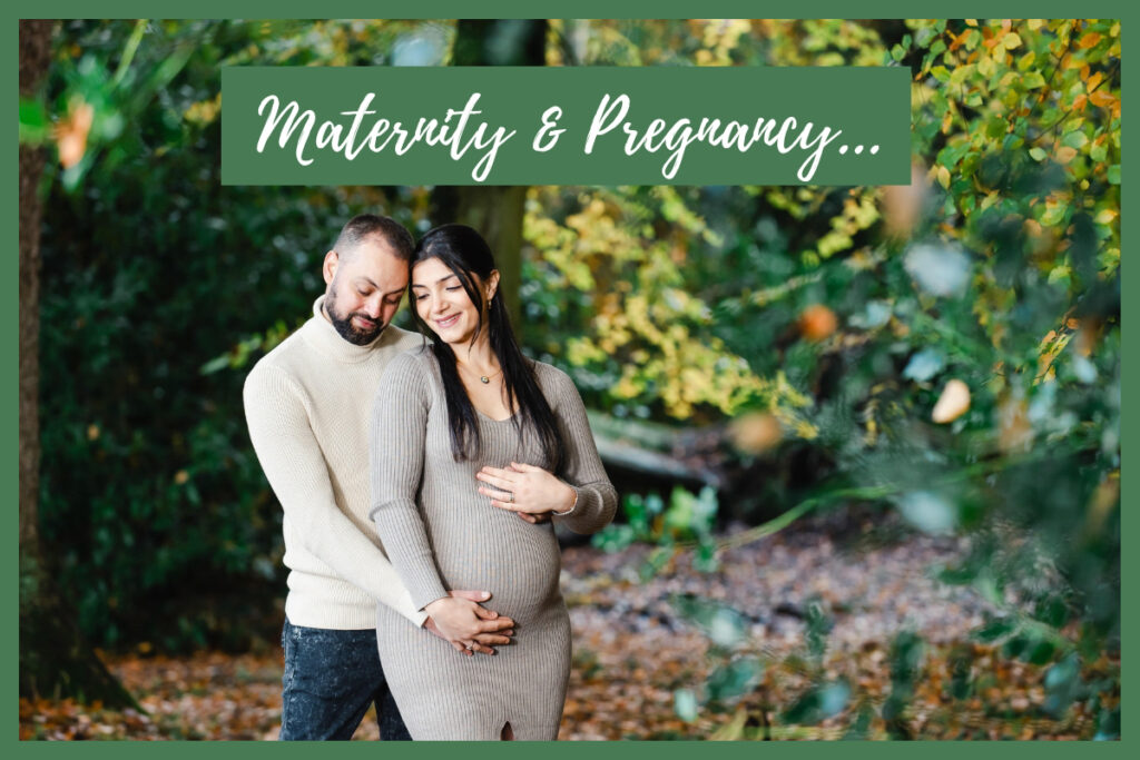 Maternity and pregnancy announcement promotional image of a man and woman dressed in grey in the woods holding the baby bump
