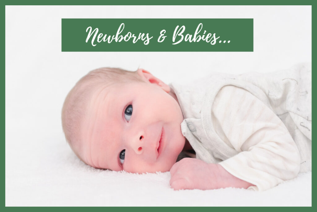 Baby and natural newborn photography promotional image showing a high key portrait of a baby in white clothing